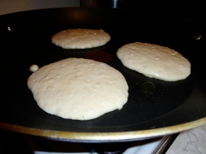 the trick to the perfect pancake is to flip them when they begin to bubble.  You should be able to see the outer part firming up.